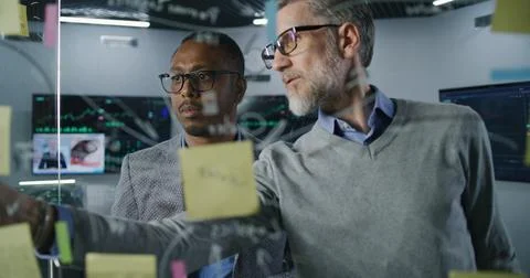 Financial analysts develop business strategy in investment bank office Stock Photos