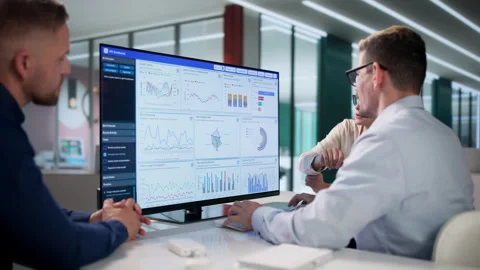 Financial Analysts Discuss Key Performance Indicators Stock Footage 337629019