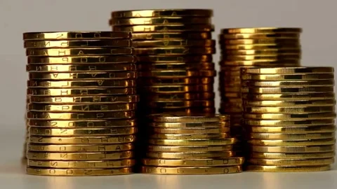 Financial background, money, gold coins on a wooden table, the concept of Video stock 272771653