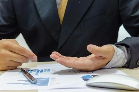 Financial business man document graph analyzing Stock Photos