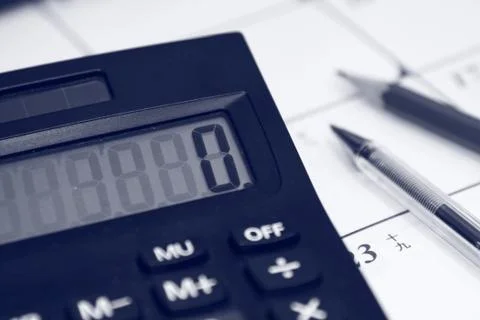 Financial calculation on table Stock Photos