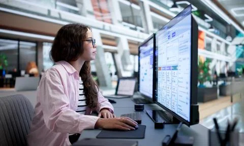 Financial Compliance Officer Using Software To Detect Suspicious Transactions Stock Photos