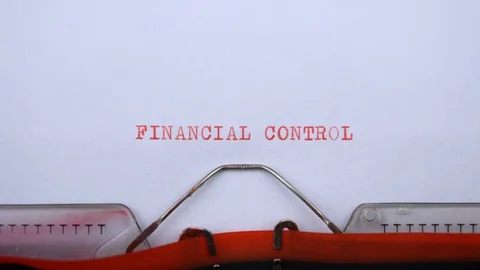 Financial control - phrase printed on an old typewriter in red letters, close up Stock Footage 129535569