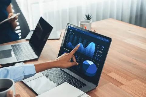 Financial dashboard data display on laptop screen. Concord Stock Photos