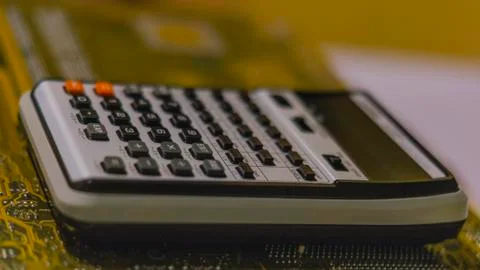 Financial data analyzing hand writing and counting on calculator Stock Photos