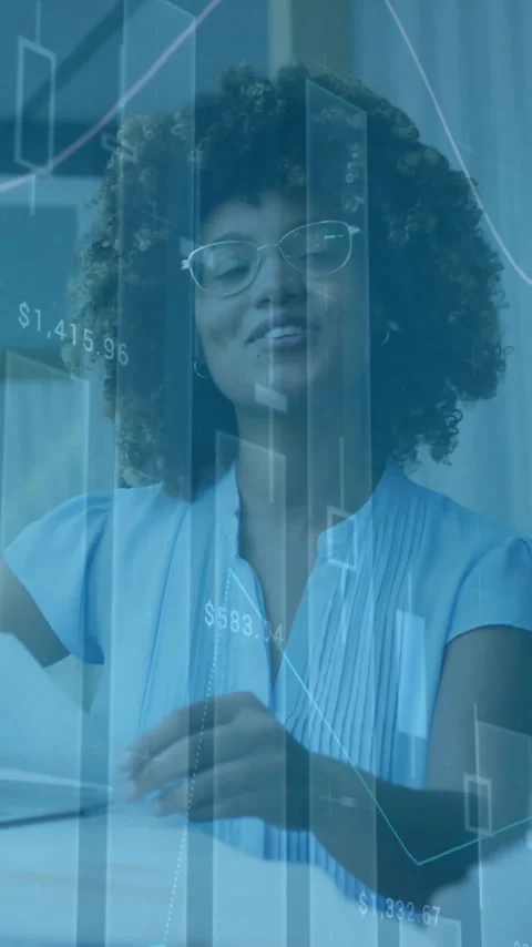 Financial data charts animation over businesswoman working with documents in Stock Footage 343645530