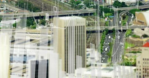 Financial data charts image over urban cityscape with roads and buildings 스톡 사진