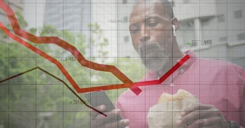Financial data processing against african american man using smartphone and Foto stock