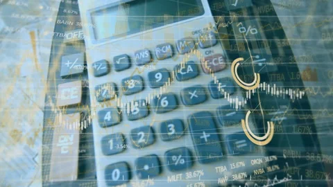 Financial data processing against calculators and documents Stock Footage 135458118