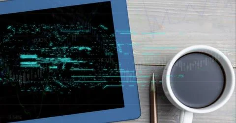 Financial data processing against digital tablet and coffee cup on wooden 库存照片