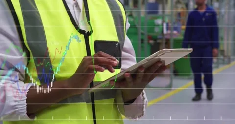 Financial data processing against mid section of engineer using digital tablet Stock Footage 328506475