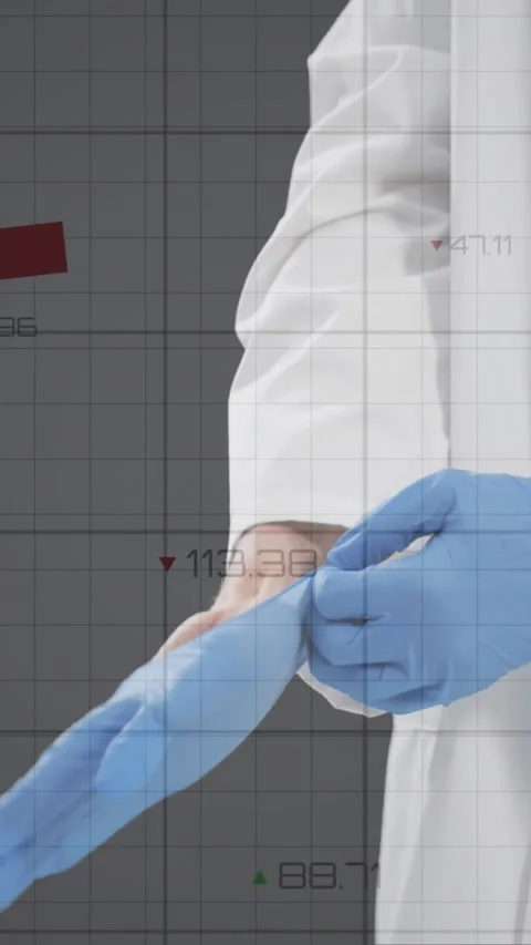 Financial data processing against mid section of doctor wearing surgical gloves Stock Footage 331718017
