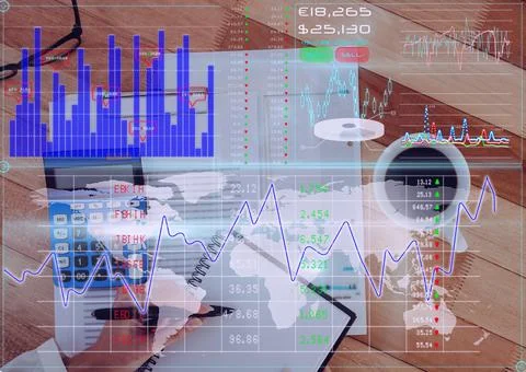 Financial data processing against person writing notes and office equipment on 库存照片