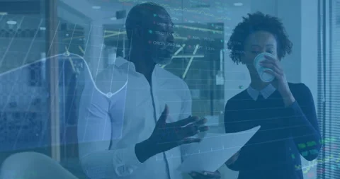 Financial data processing animation over business people discussing documents in Stock Footage 305622076