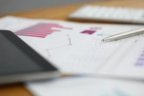 Financial document on desk Stock Photos