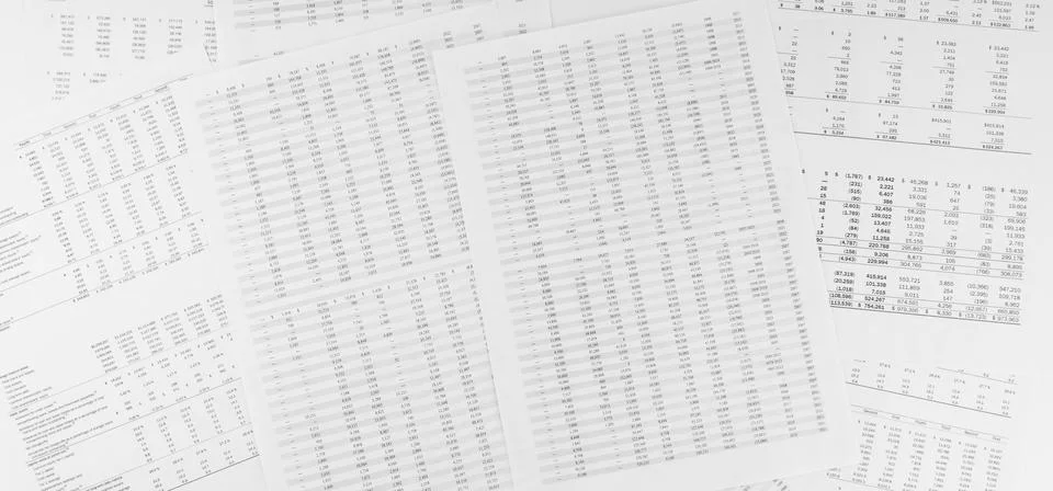 Financial documents lying on the table. Close-up view. Stock Photos