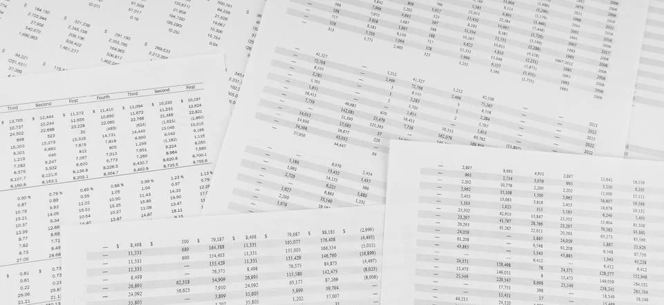 Financial documents lying on the table. Close-up view. Stock Photos