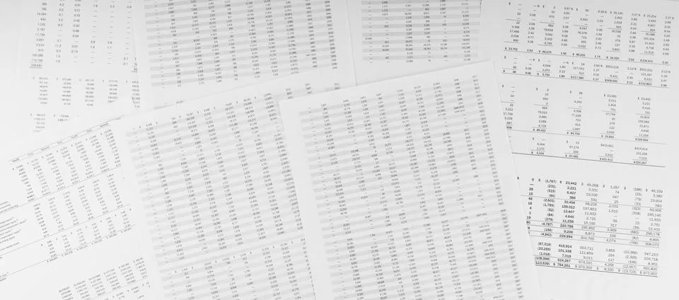 Financial documents lying on the table. Close-up view. Stock Photos