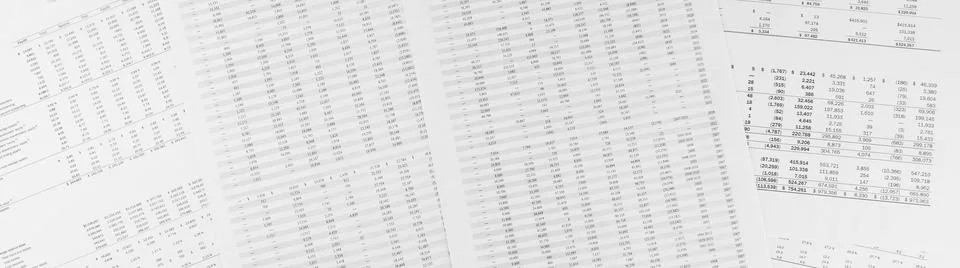 Financial documents lying on the table. Close-up view. Stock Photos