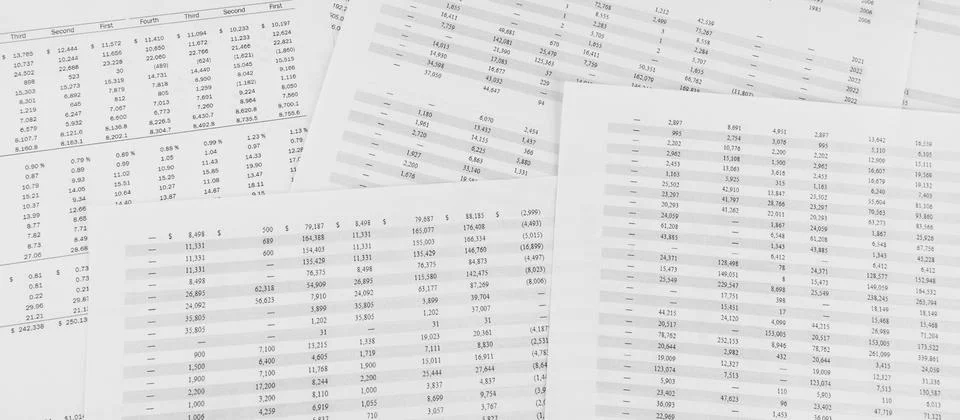 Financial documents lying on the table. Close-up view. Stock Photos
