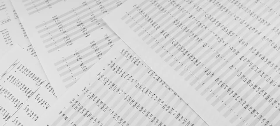Financial documents lying on the table. Close-up view. Stock Photos