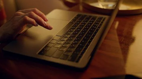Financial expert looking computer screen on plane. Closeup hands touch trackpad Stock Photos