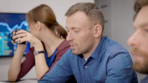 Financial experts are communicating at working meeting in office room, man and Stock Footage 120405319