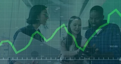 Financial graph image over diverse colleagues discussing work in modern office Stock Photos