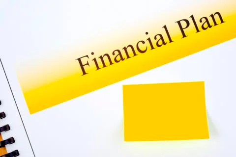 Financial plan with matching sticky note Stock Photos