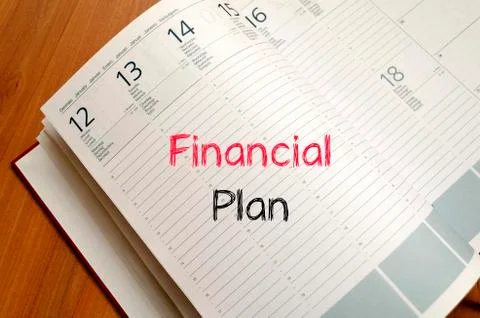 Financial plan text concept on notebook Stock Photos