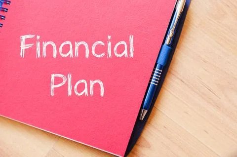 Financial plan text concept on notebook Stock Photos