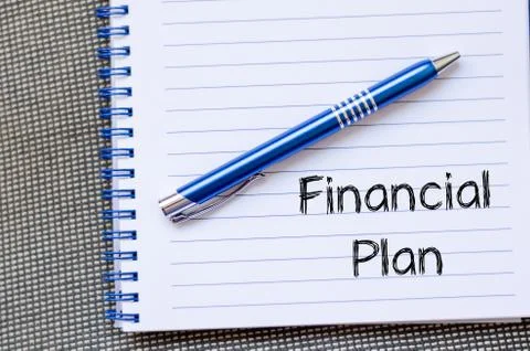 Financial plan text concept on notebook Stock Photos