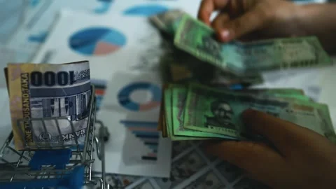 Financial Planning with Currency and Documents Footage, A miniature shoppin.. Видео 304961351