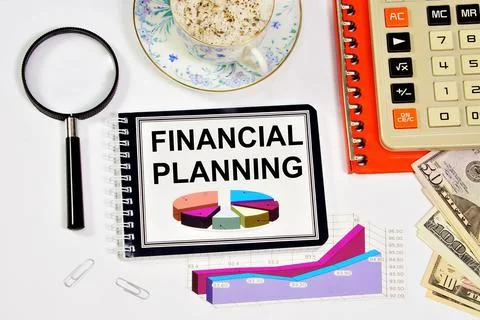 Financial planning. A text label in a working notebook. Stock Photos