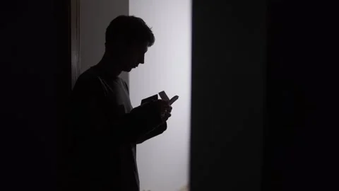 Financial pressure and avoidance, man counting money then withdrawing into room Stock Footage 325184373