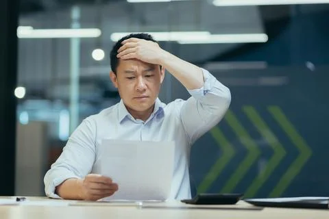 Financial problems, contract with partners, clients, project. Young Asian Stock Photos