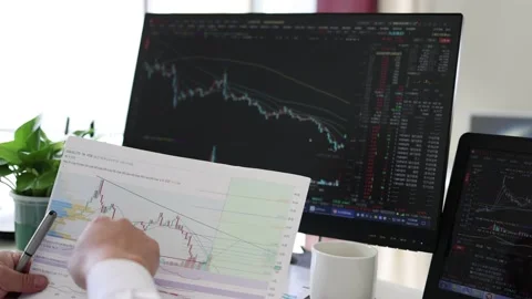Financial professionals who analyze and study stock trend data charts of lis Stock Footage 165790637