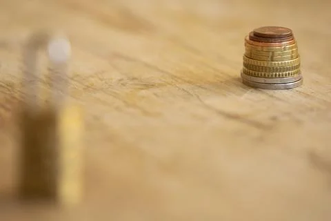 Financial protection concept with coins stack and blurred padlock Stock Photos