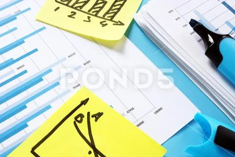 Financial report for audit. Stack of papers with business charts. Stock Photos