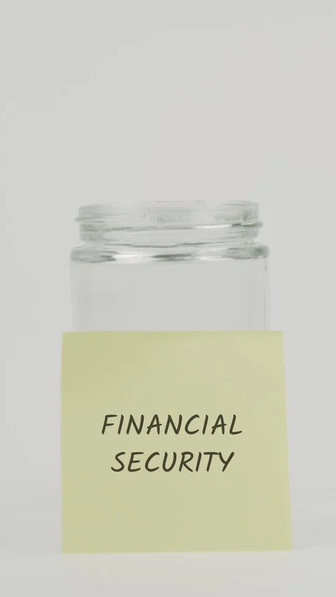 Financial security text or word on yellow sticky note attached to glass jar Stock Footage 311733148