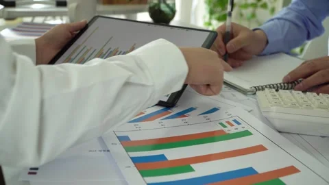 Financial staff conducts data report statistics and analysis Stock Footage 313772124