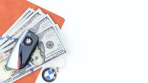 Financial Success Concept Stack of Dollar Bills with BMW Car Key and Wallet Stock Photos