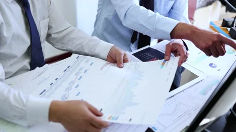 The financial team analyzes and communicates the stock market Stock Footage 193987797