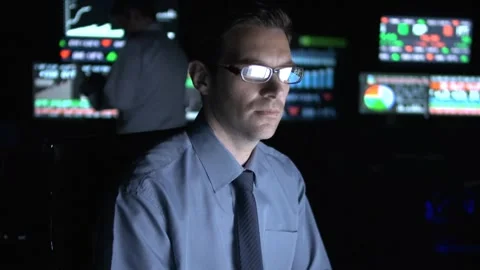 Financial trader in front of monitors Stock Footage 199634769