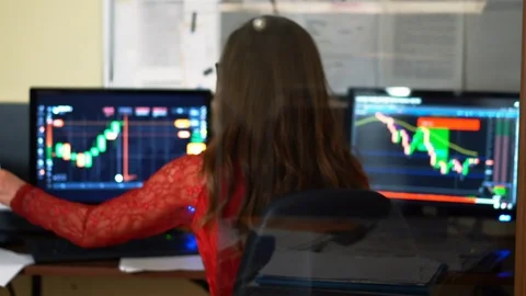 Financial trader working on the background of monitors full of diagrams. World Stock-Footage 93873409