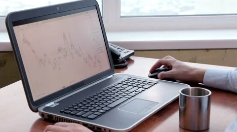 Financier checking exchange rates Stock Footage 44672318