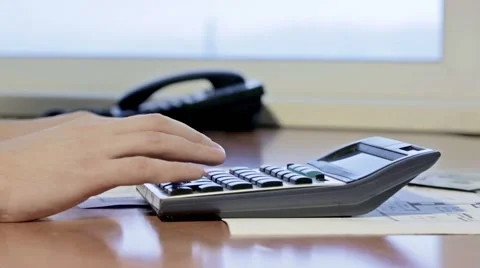 Financier working on the calculator Stock Footage 47449579