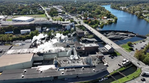 Finch Paper mill, river dam and bridge in Glens Falls, New York Stock Footage 347004098