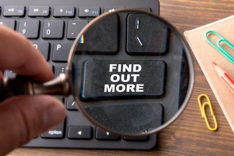 FIND OUT MORE. Computer keyboard on a wooden table Stock Photos