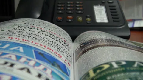 Find a phone number in the directory Stock Footage